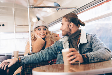 Beloved couple in cafe bus relaxing together