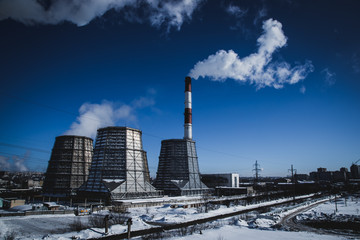 Obraz premium thick smoke comes from the pipes of a thermal power plant