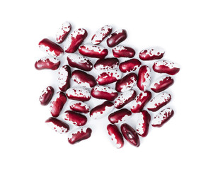 Pile of ripe speckled kidney Anasazi beans, with vivid burgundy color isolated on white background. Close-up.
