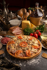 Pizza with minced meat, beacon and mushrooms for a restaurant menu.