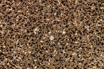 a scattering of small stones on the surface, this decoration of the facade of the building wall will be a good choice of building designers