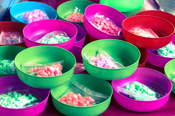 Water bowl with .soft-prepared chalk (or clay rich in alumina) on sales for playing in Songkran Festival day..