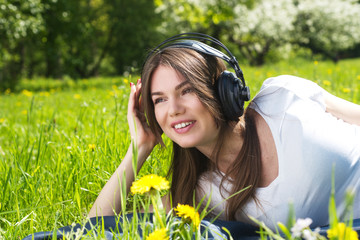 Woman listening music outdoors
