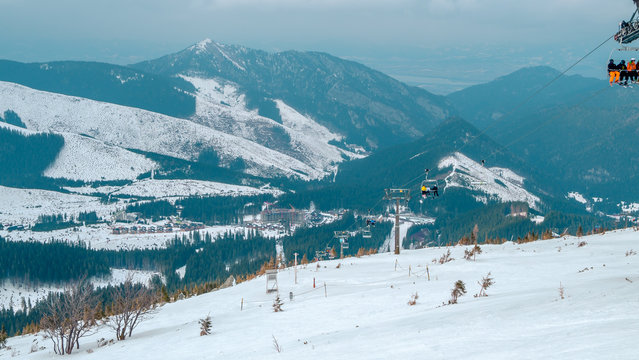 Jasna resort, LIPTOV, SLOVAKIA - February, 2019: Blue sky with snow clouds and new modern lift Funitel in Jasna, Liptov region, Slovakia.