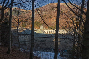 Panoramic view in the afternoon light on a winter day, of the seventeenth-century monumental complex dedicated to the Virgin Mary, of the Sanctuary of Oropa in Piedmont, Italy.