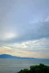 Florianopolis Brazil Sunset in Praia do forte near Jurere international with calm green water and in the background the prairies of bombinias