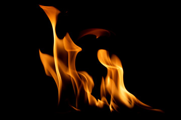 Bright orange flame isolated on black background