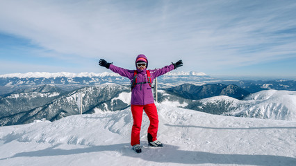 Women skier finding the best track. Skier looking down to the valley. Waiting for right moment....