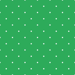 seamless background of white polka dots on green