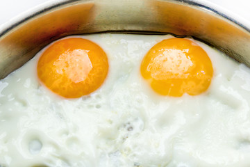 fried eggs in a breakfast pan healthy protein