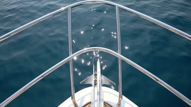 Detail of the bow of a yacht cruising.