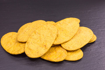 heap of carrot and spelt cracker - triticum spelta