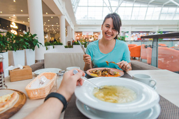 couple eating in cafe. point of view