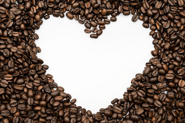Roasted coffee beans background in the shape of heart