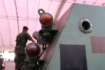 Headlight on a green military tank, close-up