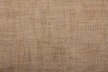 Hessian sackcloth burlap woven texture background / cotton woven fabric background with flecks of varying colors of beige and brown. with copy space. office desk concept.