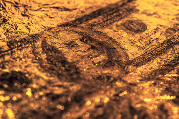 Closeup Benjamin Franklin on the 100 dollar grunge art abstract background. Dark, gloomy, crumpled.