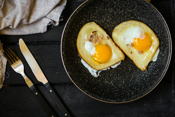 fried eggs in bread, scrambled eggs (yolk and white) sandwich. food background