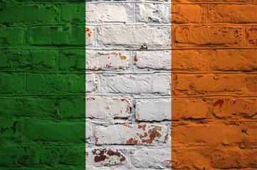 Irish flag on brick wall background.