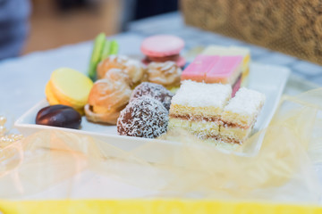 Sweet tasteful desserts on the table, celebration concept