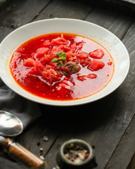 red tomato soup with vegetables and meat balls (borsch with meat) first course. top  food background. copy space
