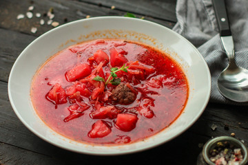 red tomato soup with vegetables and meat balls (borsch with meat) first course. top  food background. copy space