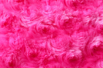 Naklejka na ściany i meble Texture of fuzzy pink fabric as background, closeup