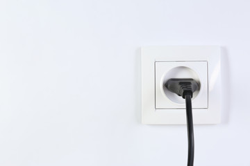 Power socket and plug on white background. Electrician's equipment