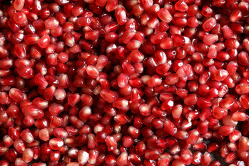 Fresh juicy pomegranate seeds as background, top view