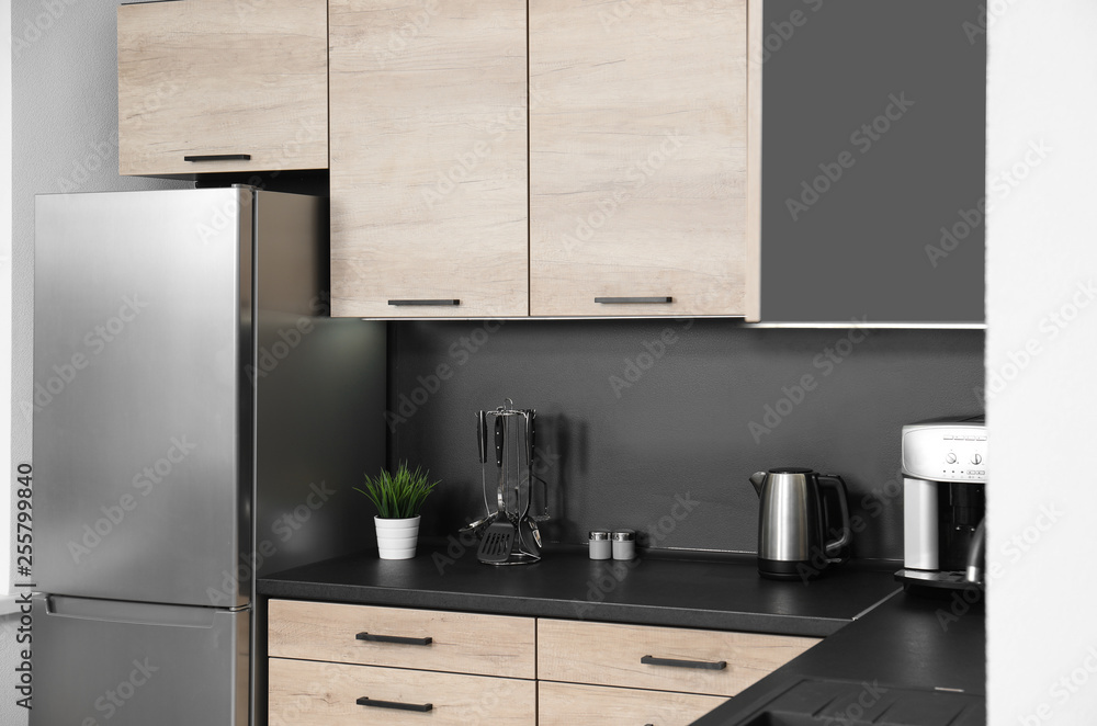 Sticker Cozy modern kitchen interior with new furniture and appliances