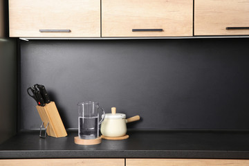 Composition with kitchenware on countertop. Space for text