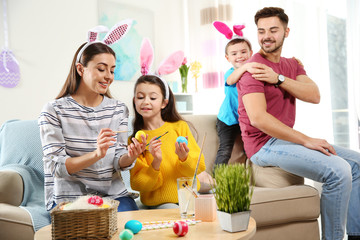 Happy family preparing for Easter holiday at home