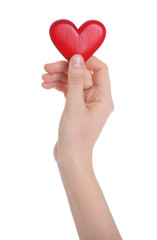 Woman holding decorative heart in hand on white background, closeup