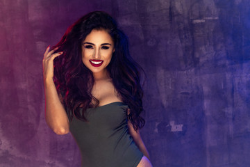 Fototapeta premium Brunette fashion girl with long and shiny curly hair . Beautiful model with smile