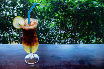 Iced coffee mix with honey and lemon juice on the wooden table