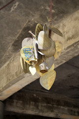 February 13, 2019. Phuket, Thailand. Metal hearts with wishes near a huge sculpture and the temple of the Great white Buddha in Phuket.