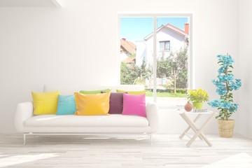 White stylish minimalist room with sofa and summer landscape in window. Scandinavian interior design. 3D illustration