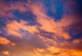 Naklejka na ściany i meble Dramatic sky with orange clouds at sunset
