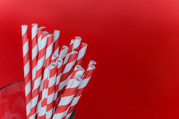 Red drinking straws in a glass