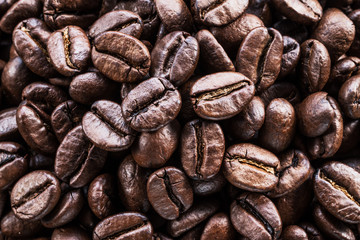 Fototapeta premium Roasted coffee beans. Food and drink background. Top view.