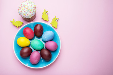 Colorful Easter eggs as an attribute of Easter celebration. Pink background.