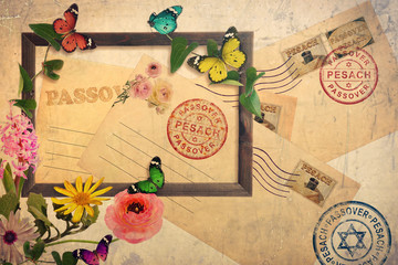 Pesach -Passover post envelopes with postage stamps and prints. Jewish holiday traditional symbols matzoh or matzo and wine. Wooden picture frame beautiful wild flowers and butterflies. Old paper
