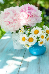 Bouquet of pink peonies and daisies, greeting card or summer calendar