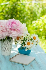 Bouquet of pink peonies and daisies, greeting card or summer calendar