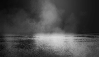 Background scene of empty street. Night view of the river, the night sky with clouds, the reflection of light on the water. Smoke fog