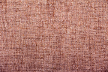 Hessian sackcloth burlap woven texture background / cotton woven fabric background with flecks of varying colors of beige and brown. with copy space. office desk concept.
