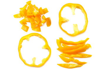 cut slices of yellow sweet bell pepper isolated on white background top view