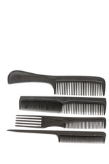 hair tools, beauty and hairdressing concept - different combs on white background