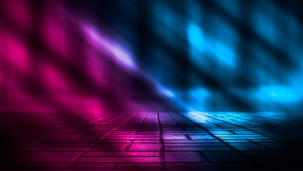 Background of empty street at night. Concrete paving slabs, illuminated by the light of...