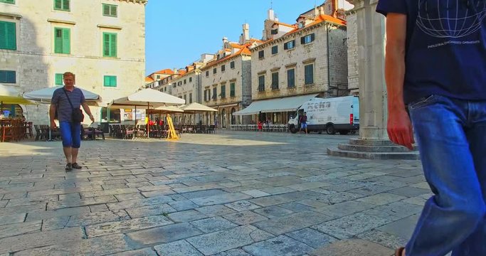 The walk in old town Dubrovnik on Strada street. Historic heritage travel.